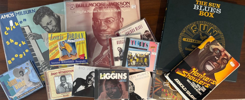 A collection of CDs, records, and books on 1940s R&B